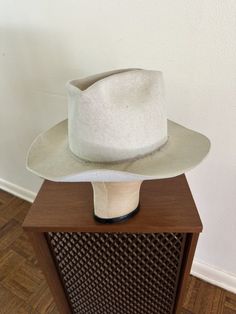 For your consideration Original vintage 1960s era American Hat Company 3x Clear Beaver western hat from BRAZOS TRAIL SADDLERY ELGIN TAYLOR, Texas Grosgrain headband is missing Black leather sweatband Marked size 7 1/2 Inventory tag underneath sweatband Color: Ivory Made in USA Price tag sticker on sweatband faded away Comes off a ranch property in Central Texas This is a good character hat - sold AS IS .. in pre-owned condition .. shows obvious patina'd soiling on crown and top of brim .. moth n American Hat Company, Taylor Texas, Price Tag Sticker, Ranch Property, American Hat, Tag Sticker, Western Hat, Honky Tonk, Central Texas