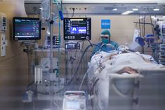 a hospital room filled with medical equipment and monitors