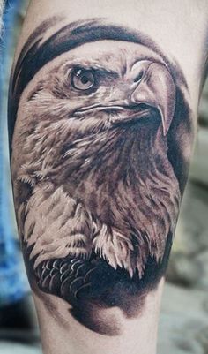 an eagle with a hat on his head is shown in this black and white tattoo