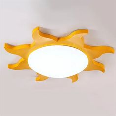 the ceiling light is shaped like a sun