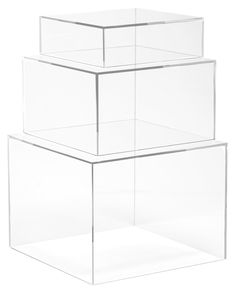 three clear boxes stacked on top of each other in the shape of rectangles