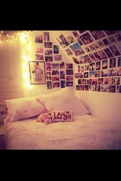 a white bed topped with lots of pictures and lights