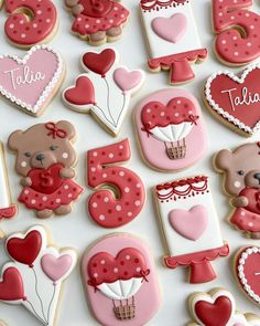 decorated cookies arranged in the shape of hearts and teddy bears for valentine's day