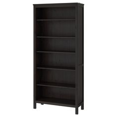 the bookcase is dark brown and has three shelves on each side, with one door open