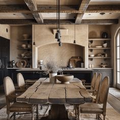 a large wooden table sitting inside of a kitchen