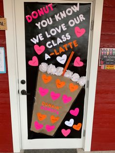 a door decorated with paper hearts and a sign that says don't you know we love our class