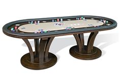 a wooden table with poker chips on it