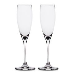 two empty wine glasses sitting next to each other