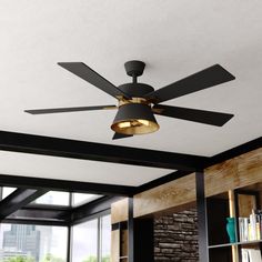 a ceiling fan in a living room next to a book shelf with books on it