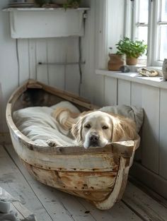 a dog laying in a wooden boat shaped bed