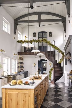 a kitchen with black and white checkered flooring