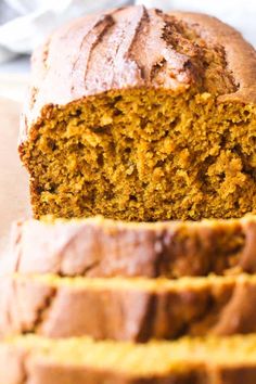 a loaf of pumpkin bread sitting on top of a cutting board