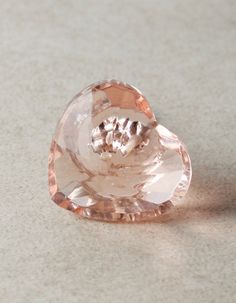 a pink diamond sitting on top of a table