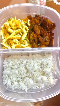 a plastic container filled with rice and meat