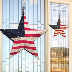 two patriotic stars hanging from the side of a door