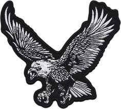 an embroidered eagle patch on white background