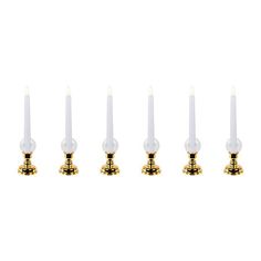 six candles are lined up in a row