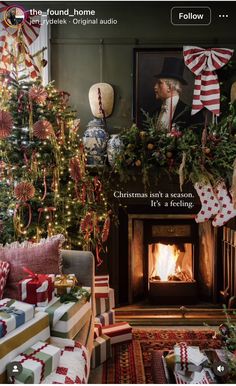 a living room decorated for christmas with presents around the fire place and stockings on the mantle