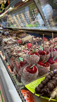 an assortment of desserts on display in a store