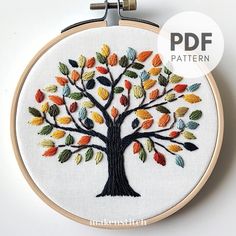 an embroidered tree with colorful leaves is shown on a white background and has the text, free pattern