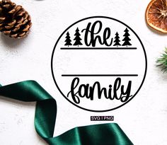 the family svg file is shown with pine cones, oranges and evergreen branches