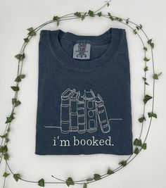 I'm Booked T-shirt, Book Lover Shirt, Comfort Colors Embroidered Bookworm Tee, Reading Gift, Bookish Crewneck,  Sizing & Shirt Information: - Embroidery design is 5x7, the design will appear smaller on larger sweatshirts - T-Shirts are Comfort Colors Brand IMPORTANT ORDERING INFORMATION: - Please review the sizing charts, with measurements, that are in the listing photos before purchasing.  - Cancellations are accepted within 24 hours of placing your order. After that, your order is possibly in production and we cannot guarantee cancellation.  Thank you for choosing Merexi Embroidery! Book Club Shirt Ideas, Bookish Crewneck, Book Box Ideas, Bookish Tshirt, Reading Cozy, Mom Fit Jeans, Mom Fits, Millennial Mom, Mom Jeans Outfit