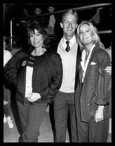 black and white photograph of three people standing together