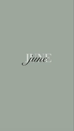 the word june written in black ink on a gray background