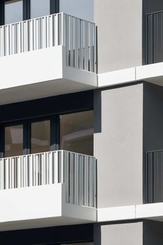 an apartment building with balconies and balcony railings