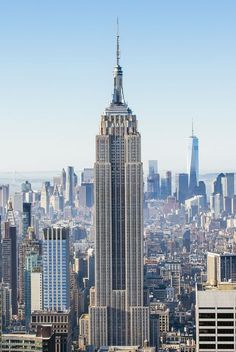 an aerial view of the empire building in new york city, with skyscrapers visible