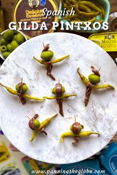 6 little toothpick appetizers of an olive, pickled pepper and anchovy, all on a round marble platter. One Bite Appetizers, Best Fish Recipes, Impressive Appetizers, Spanish Appetizers, Quick And Easy Appetizers, Amazing Appetizers, Mediterranean Food, Best Gluten Free Recipes, European Food