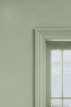 an open window in a white room