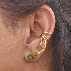 Raw Peridot Curve, Ear Wrap, Ear Cuff, Ear Climber, Ear Crawler, silver ear Climber * 18k gold Fill ear climber, gold ear wrap, raw crystal Handmade Delicate 18k Gold Filled Over Sterling Silver Ear Climbers Earrings Will insure many compliments with almost any outfit. Details:- Material :- 925 Sterling Silver or 18k Gold Filled over Silver Stone: Raw Peridot. Handmade With Love In India ! For Express Shipping Please Contact us Before placing your order! ----------------------------------------- Hug Earrings, Climbers Earrings, Raw Tourmaline Ring, Minimalist Ear Cuff, Raw Peridot, Silver Ear Climbers, Ear Crawler, Silver Chandelier Earrings, Ear Crawler Earrings