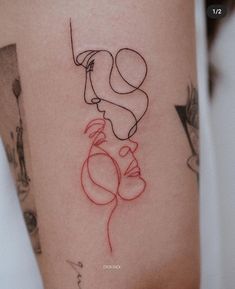 a woman's leg with a tattoo on it that has an image of a man holding a balloon