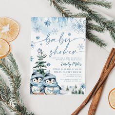 a baby shower with two penguins and orange slices