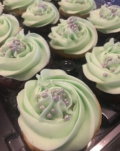 cupcakes with green frosting and pearls on top