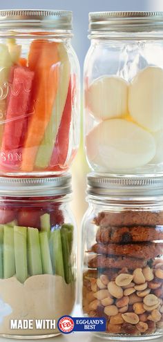 three jars filled with different types of food