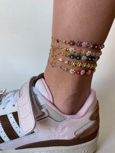 ✨💖 Half-and-Half Anklets 🌸✨ Any of these super trendy anklets in 5 different color will become your favourite piece of jewelry for summer. The gold plated chains with hearts and stars will put the cuteness level up to a million!! Their floral/golden chain design will make sure that you fall in love with them at first sight😍🌸 This unique and original design is really cool and you will feel like a model during New York Fashion Week wearing them😉  I use the all-natural and high quality materials so you could enjoy your jewelry for a long time 🫶🏻 ✨Size✨ * I always recommend that you measure the length of your ankle before ordering, so that you can be sure of a perfect fit * The anklets are made individually for you depending on the size * The anklets also has a small extension chain of Things To Make With Small Beads, Trendy Multicolor Anklets For Spring, Layered Anklets, Spring Anklets With Colorful Beads, Colorful Beaded Anklets For Spring Gift, Trendy Handmade Anklets For Spring, Spring Gift Anklets With Colorful Beads, Trendy Colorful Beaded Anklets As Gift, Handmade Trendy Anklets For Spring