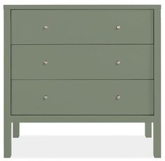 a green dresser with three drawers