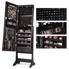 a black jewelry cabinet with lots of necklaces