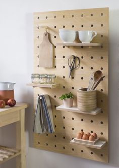 two pictures one has a wooden peg board and the other is a shelf with utensils on it