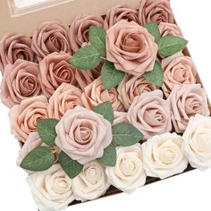 a box filled with pink and white roses