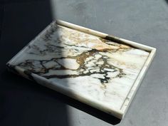 a marble tray sitting on top of a table