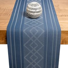 a blue table runner with white lines on it