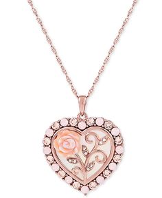 Vintage-inspired in its elegant detail, this cameo necklace features a heart-shaped with mother of pearl (16mm) pendant depicting a flowering rose. Cubic zirconia details provide a sparkling finish. Feminine Rose Jewelry For Valentine's Day, Elegant Rose Heart Shaped Necklace, Elegant Rose Heart Necklace, Feminine Rose Gold Jewelry With Rose Design, Valentine's Day Rose Gold Necklaces With Rose Design, Macy's Pink Jewelry For Wedding, Macy's Pink Wedding Jewelry, Valentine's Day Rose Gold Jewelry With Roses, Rose Gold Jewelry With Roses For Mother's Day