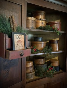 an old wooden shelf filled with lots of boxes