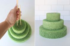 there is a green cake that has been decorated with grass