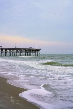 A serene scene A serene scene of a pier extending over gentle waves on a cloudy day at Myrtle Beach, inviting visitors to explore their perfect day with must-see attractions and experiences. a pier extending over gentle waves on a cloudy day at Myrtle Beach, inviting visitors to explore their perfect day with must-see attractions and experiences. Dream Day, Beach Yoga, Fresh Seafood, Perfect Day