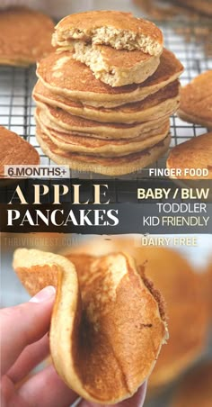 a stack of pancakes sitting on top of a metal rack next to a hand holding one