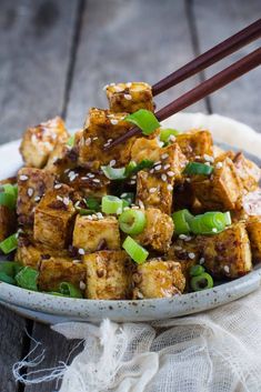 tofu with green onions and sesame seeds in a bowl